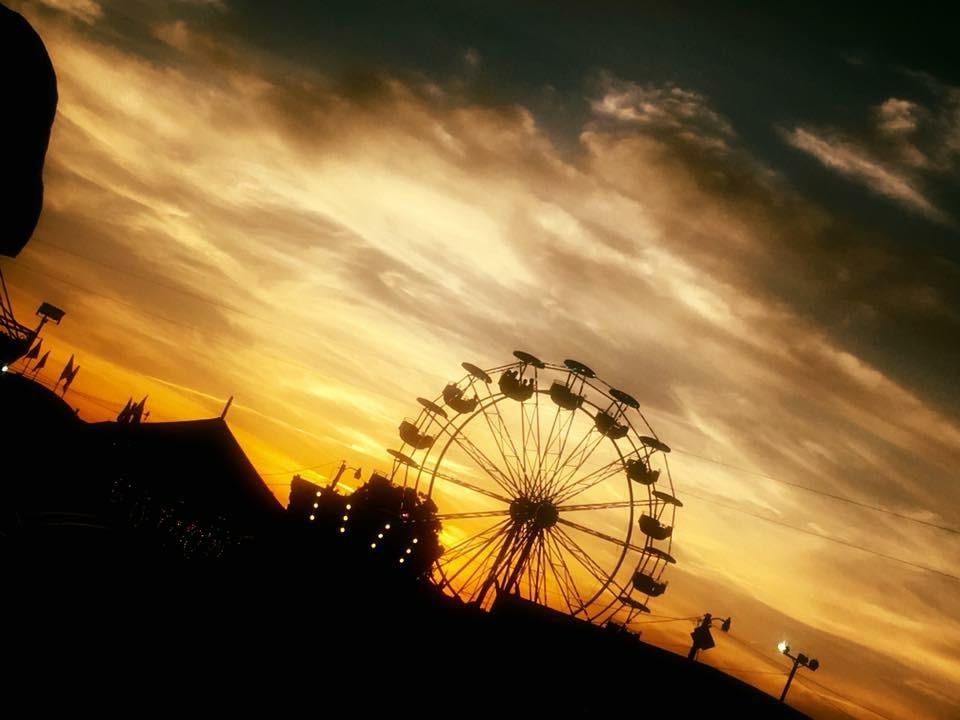 Ferris wheel silhouetted against a dramatic Tennessee sunset