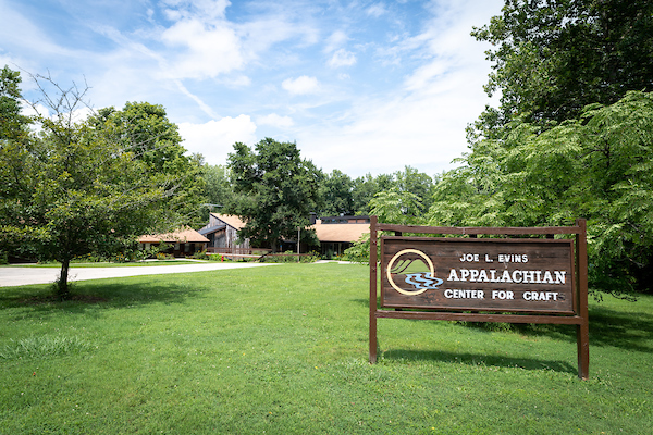 Entrance sign and campus buildings at the Joe L. Evins Appalachian Center for Craft